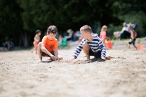 A young child in a car seat looking at a data brief